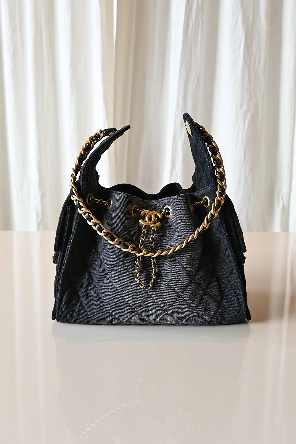 Chanel 25 small black denim bag